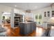 Spacious kitchen with stainless steel appliances, granite countertops, and grey kitchen island at 692 Brooks Woolsey Rd, Brooks, GA 30205