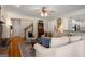 Comfortable living room featuring an area rug, hardwood floors, and a cozy seating area at 692 Brooks Woolsey Rd, Brooks, GA 30205