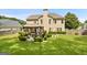 Large backyard featuring a cozy gazebo, lush green lawn, and mature trees at 960 Pebblestone Ct, Alpharetta, GA 30009