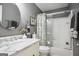 Charming bathroom with marble countertops, a decorative mirror, and a shower-tub combo at 960 Pebblestone Ct, Alpharetta, GA 30009