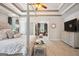 This primary bedroom has a tray ceiling, a four poster bed, and a large walk-in closet at 960 Pebblestone Ct, Alpharetta, GA 30009