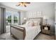 Bright bedroom boasts plush carpet, neutral tones, and a window with backyard views at 960 Pebblestone Ct, Alpharetta, GA 30009