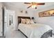 Cozy bedroom with neutral decor, a decorative ceiling fan, and carpet flooring at 960 Pebblestone Ct, Alpharetta, GA 30009