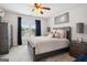 This modern bedroom features carpet floors, overhead lighting, and a decorative ceiling fan at 960 Pebblestone Ct, Alpharetta, GA 30009