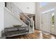 Inviting foyer with gleaming hardwood floors, an elegant staircase, and ample natural light at 960 Pebblestone Ct, Alpharetta, GA 30009