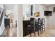 This modern kitchen bar features dark wood accents, bar stool seating, and stylish decor at 960 Pebblestone Ct, Alpharetta, GA 30009