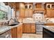 Gourmet kitchen features granite countertops, custom cabinets, and stainless steel appliances at 960 Pebblestone Ct, Alpharetta, GA 30009