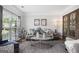 Cozy living room featuring stylish decor, comfortable seating, and natural lighting at 960 Pebblestone Ct, Alpharetta, GA 30009