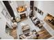 Open living room with hardwood floors, a fireplace, and lots of natural light at 960 Pebblestone Ct, Alpharetta, GA 30009