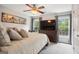 This spacious main bedroom features a plush bed, a ceiling fan, and dual windows at 960 Pebblestone Ct, Alpharetta, GA 30009