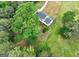 Aerial view of a charming house nestled in a lush, green landscape with mature trees and expansive lawns at 375 Foster Dr, Mcdonough, GA 30253