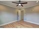 Cozy bedroom featuring hardwood floors, neutral walls, and doorways leading to other rooms at 375 Foster Dr, Mcdonough, GA 30253