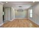 Dining room with stunning hardwood flooring and modern light fixture at 375 Foster Dr, Mcdonough, GA 30253