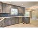 Kitchen featuring gray cabinets, stainless steel appliances, and tiled backsplash at 375 Foster Dr, Mcdonough, GA 30253