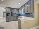 Modern kitchen showcasing gray cabinets, stainless steel appliances, and quartz countertops at 375 Foster Dr, Mcdonough, GA 30253
