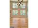 Living room with hardwood floors and large windows providing ample natural light at 375 Foster Dr, Mcdonough, GA 30253