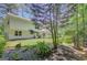 Lush backyard with verdant lawn, landscaping, and the home's exterior in the background at 157 Rockspray Rdg, Peachtree City, GA 30269