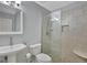 Bathroom with glass shower, neutral tile, and a floating sink at 157 Rockspray Rdg, Peachtree City, GA 30269