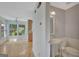 Bathroom next to a sunny dining area, featuring a pedestal sink and a well-maintained toilet at 157 Rockspray Rdg, Peachtree City, GA 30269