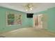 Spacious bedroom with large window, a ceiling fan, and an ensuite bathroom at 157 Rockspray Rdg, Peachtree City, GA 30269