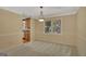 Dining room with natural light, wainscoting, and chandelier adjacent to kitchen at 157 Rockspray Rdg, Peachtree City, GA 30269