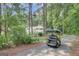 Home with a golf cart parked in the driveway, surrounded by lush trees at 157 Rockspray Rdg, Peachtree City, GA 30269