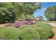Community entrance sign with beautiful landscaping and an American flag at 157 Rockspray Rdg, Peachtree City, GA 30269