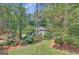 Beautiful home surrounded by lush landscaping and mature trees at 157 Rockspray Rdg, Peachtree City, GA 30269