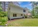 Spacious home exterior with a well-manicured lawn and mature trees at 157 Rockspray Rdg, Peachtree City, GA 30269