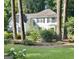 Charming two-story home with a symmetrical facade and a well-manicured lawn surrounded by mature trees at 157 Rockspray Rdg, Peachtree City, GA 30269