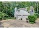 Charming white house with attached two-car garage and a beautiful, well-manicured yard at 157 Rockspray Rdg, Peachtree City, GA 30269