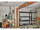 Garage with organized storage solutions, and water heater at 157 Rockspray Rdg, Peachtree City, GA 30269