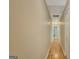 Hallway with hardwood floors and access to other rooms in the house at 157 Rockspray Rdg, Peachtree City, GA 30269
