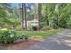 Traditional two-story home surrounded by mature trees and landscaping at 157 Rockspray Rdg, Peachtree City, GA 30269