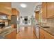 Kitchen showcases granite counters, stainless appliances, and hardwood flooring at 157 Rockspray Rdg, Peachtree City, GA 30269
