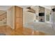 Open living area with stone fireplace, lots of natural light, and hardwood flooring at 157 Rockspray Rdg, Peachtree City, GA 30269
