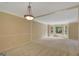 This open living room features wainscoting, overhead lighting, and a bay window at 157 Rockspray Rdg, Peachtree City, GA 30269