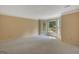 Bright, spacious living room features neutral carpet, large bay window, and crown molding detail at 157 Rockspray Rdg, Peachtree City, GA 30269