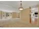 Open living room design with natural light, neutral carpet and hardwood flooring at 157 Rockspray Rdg, Peachtree City, GA 30269