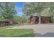 Charming log cabin with outdoor seating and playground in a serene setting at 157 Rockspray Rdg, Peachtree City, GA 30269
