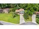 Aerial view of the house with a long driveway and established trees at 7455 Dover Ct, Riverdale, GA 30274