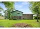 Spacious backyard showcasing the home’s brick and siding exterior at 7455 Dover Ct, Riverdale, GA 30274