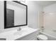 Bright bathroom featuring a shower-over-tub and a modern vanity sink at 7455 Dover Ct, Riverdale, GA 30274