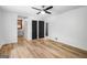 Bright bedroom with ensuite bathroom access and a modern ceiling fan at 7455 Dover Ct, Riverdale, GA 30274