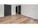 Empty bedroom with light wood floors and a closet, offering ample space at 7455 Dover Ct, Riverdale, GA 30274