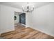 Bright dining room featuring an elegant chandelier and stylish accent wall at 7455 Dover Ct, Riverdale, GA 30274