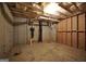 Unfinished basement offering potential for customization, with insulated ceiling, exposed piping and concrete floors at 1315 Crane Ct, Mcdonough, GA 30252