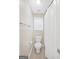 Bright bathroom featuring tiled floors, toilet, and shower/tub combo with neutral walls at 1315 Crane Ct, Mcdonough, GA 30252