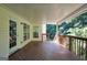 Covered wooden deck with serene wooded view, perfect for outdoor relaxing or entertaining at 1315 Crane Ct, Mcdonough, GA 30252