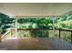 Large wooden deck provides a serene outdoor living space surrounded by lush greenery at 1315 Crane Ct, Mcdonough, GA 30252